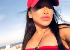 Busty babe playing with her big boobs